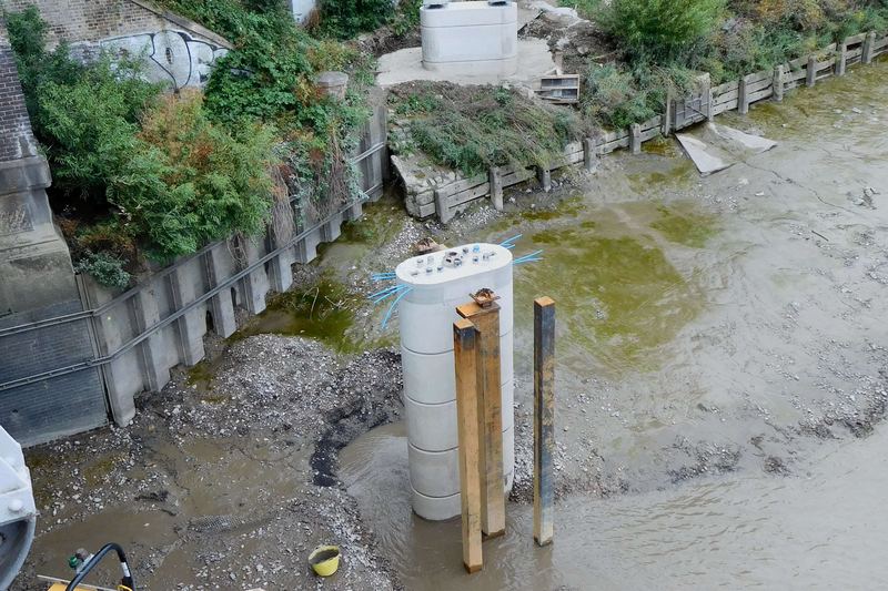Dukes Meadows Footbridge newly-cast concrete footings, seen from Barnes Railway Bridge
